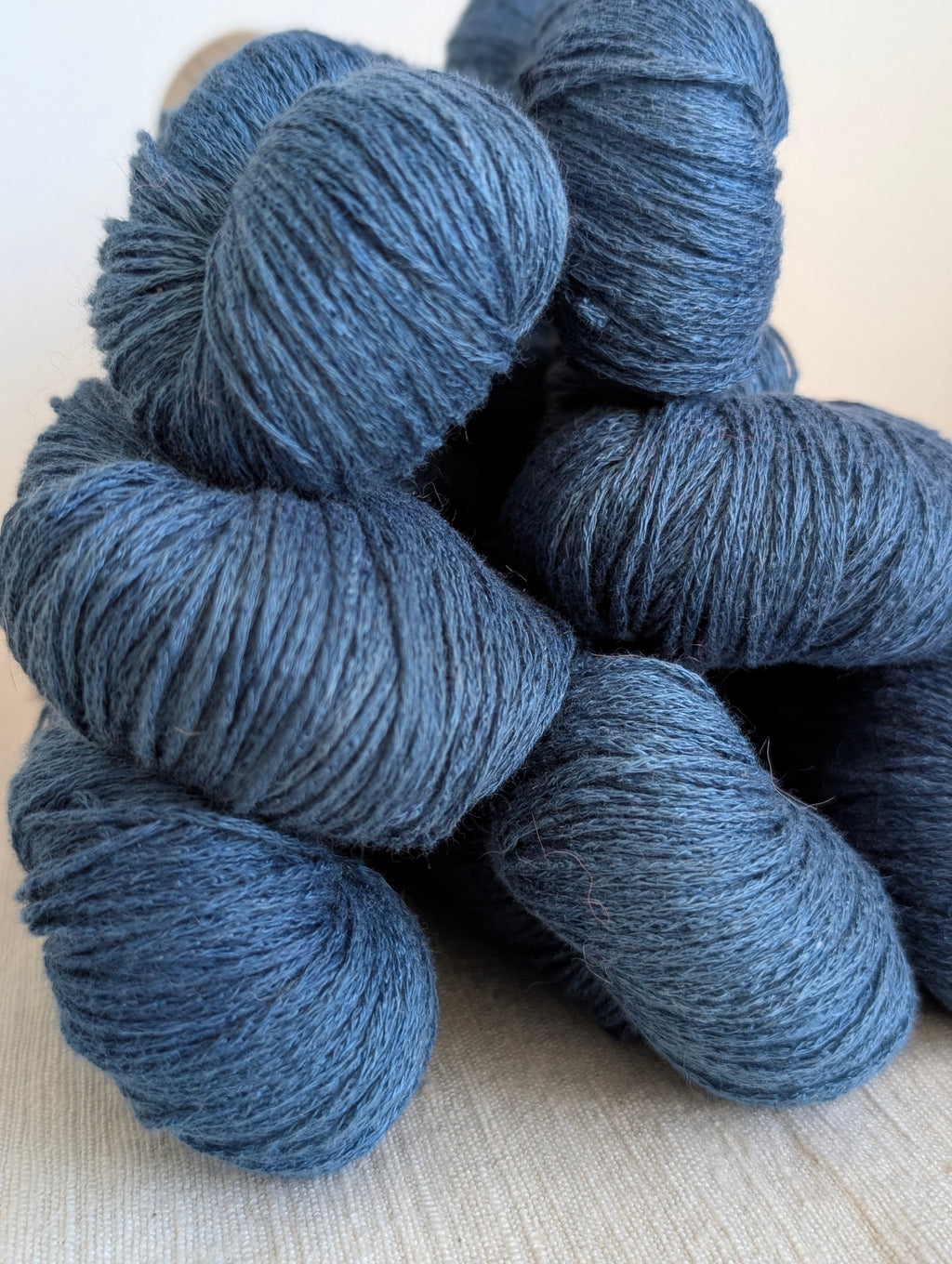 Blue yarn skeins on a light background