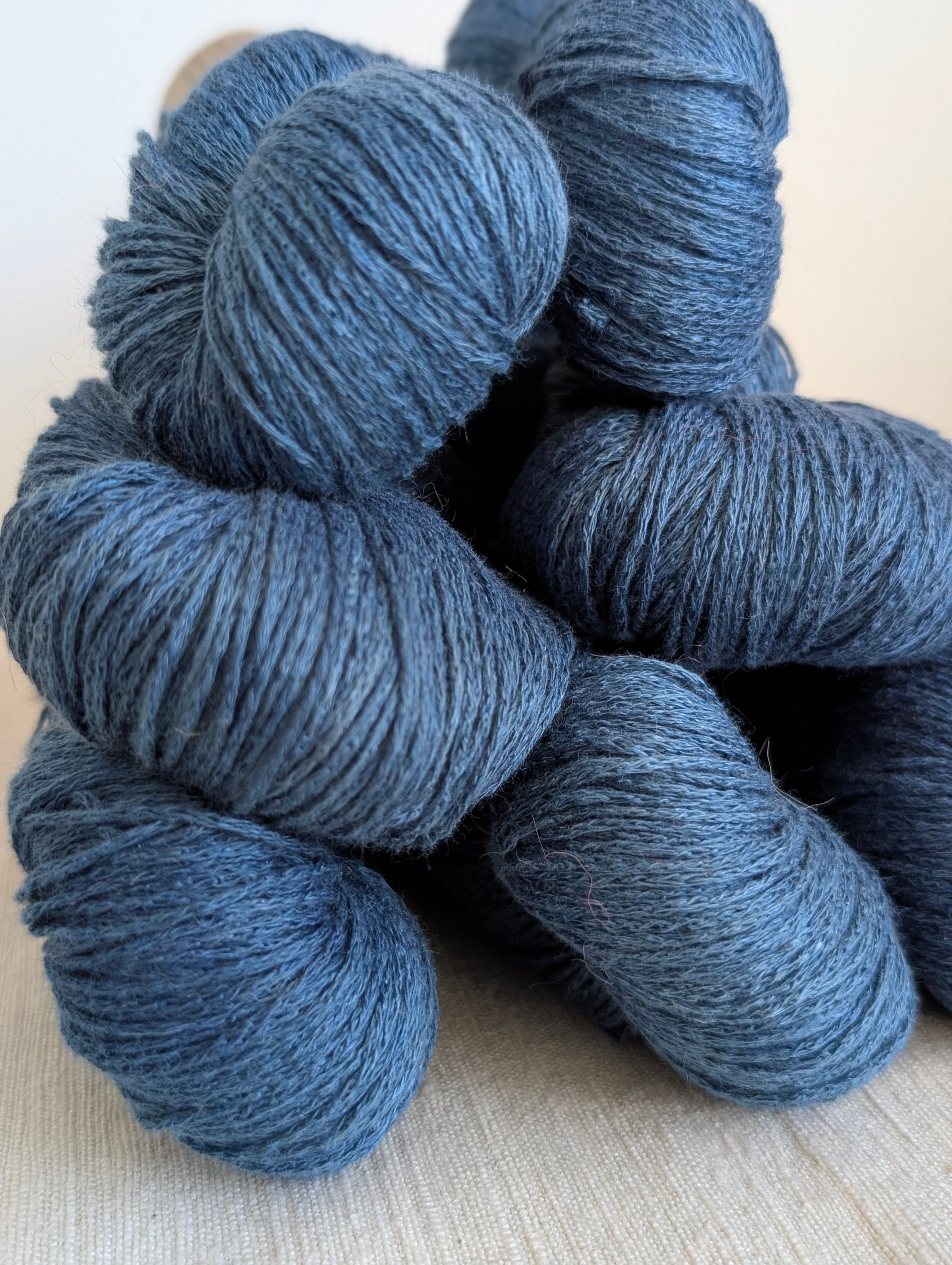 Blue yarn skeins on a light background